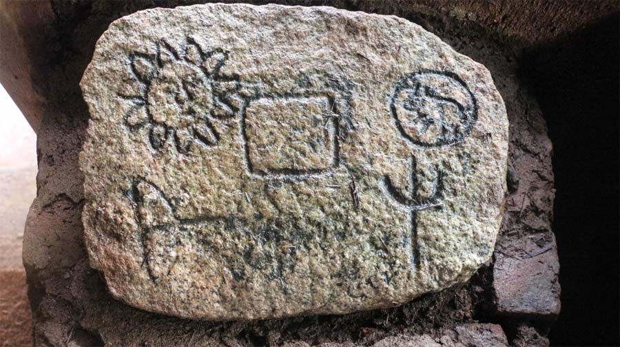 A carved granite slab at the Veddas Heritage Centre symbolises the Sun, Moon and their hunting grounds (Credit: Zinara Rathnayake